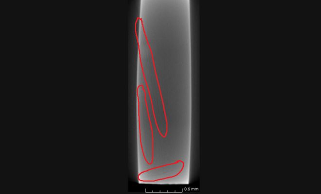 Side view of a section through the deformed sample with potential shear bands highlighted